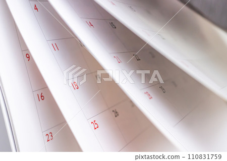 Calendar page flipping sheet close up blur background business schedule planning appointment meeting concept Calendar page flipping sheet close up blur background business schedule planning appointment meeting concept 110831759
