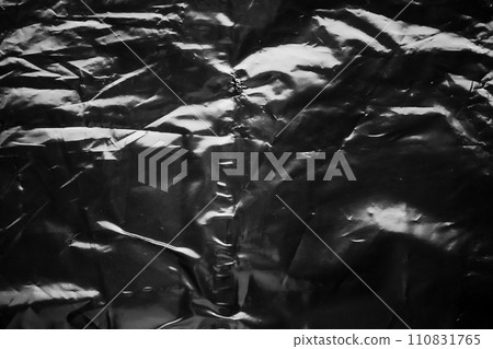 transparent plastic bag wrap overlay texture on black background 110831765