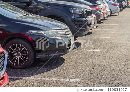 Cars parked in the outdoor parking lot 110831937