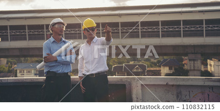 Banner asian engineer man brainstorming teams partner meeting office desk on construction site. Architecture civil Engineer contractor manager team meeting together. Teamwork business with copy space 110832115