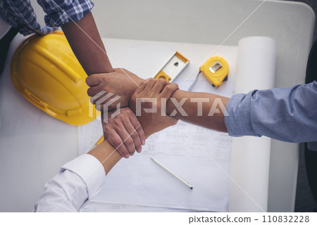 Group of multiracial people Teamwork meeting join hands Engineer Manager Foreman fist bump together. Close up diversity engineer people hands partner teams. Business connection team join partnership 110832228