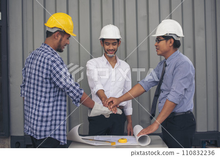 Group of multiracial people Teamwork meeting join hands Engineer Manager Foreman fist bump together. Close up diversity engineer people hands partner teams. Business connection team join partnership 110832236