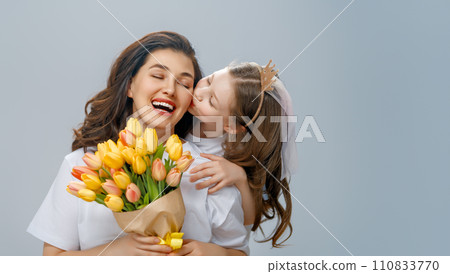 Daughter and mother with bouquet of flowers Daughter and mother with bouquet of flowers 110833770