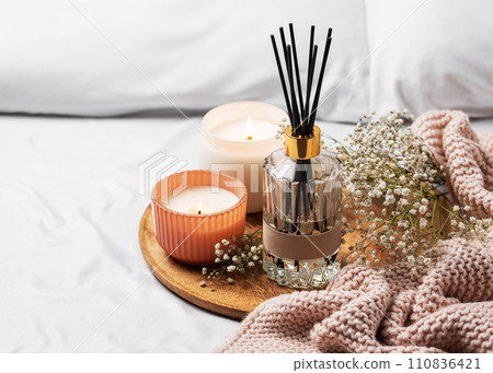 Cozy home atmosphere. Home liquid fragrance in glass bottle 110836421