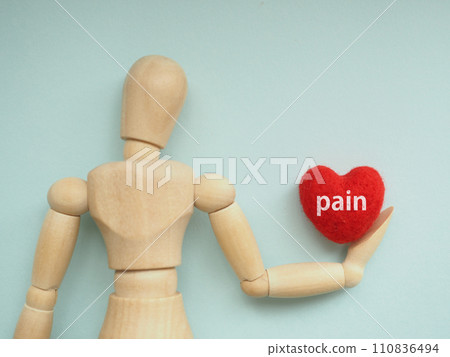 Pain letter on the heart held by a mannequin, copy space Pain letter on the heart held by a mannequin, copy space 110836494