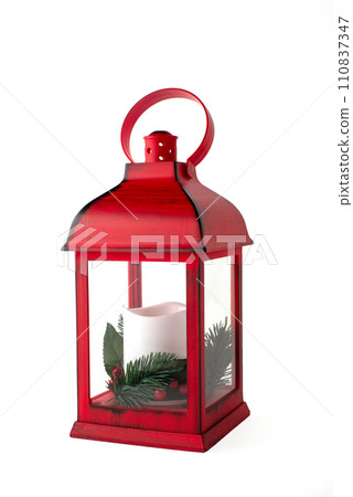 Red Christmas lantern with white candle with pine branches on a white background 110837347