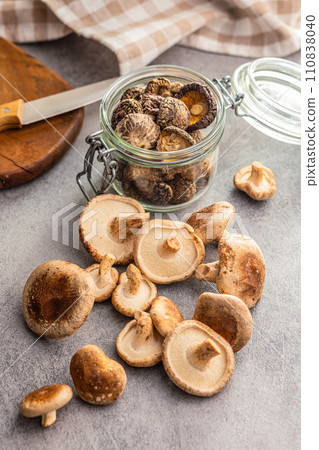 The fresh shiitake mashrooms on kitchen table. 110838040