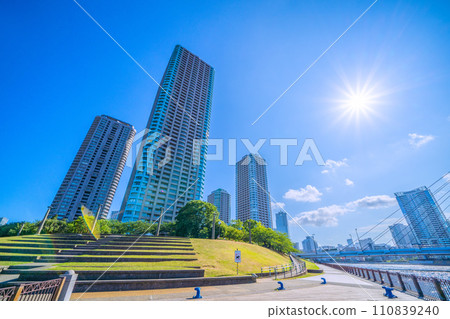 Tokyo cityscape in Japan, overlooking Okawabata River City 21 and sunlight = August 5, 2020 110839240