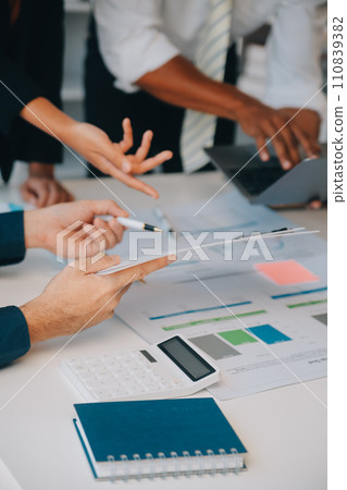 Business team working with new startup project plan and discussion information for financial strategy with laptop and digital tablet in a modern business lounge. 110839382
