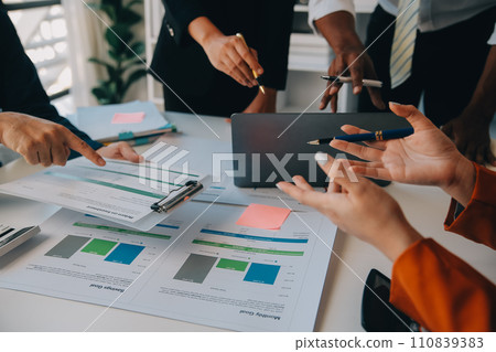 Business team working with new startup project plan and discussion information for financial strategy with laptop and digital tablet in a modern business lounge. 110839383