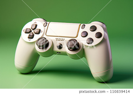 White game console on a green background 110839414