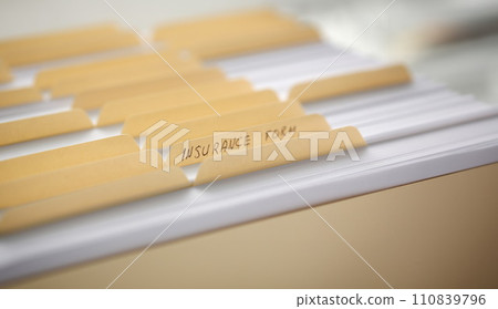 Yellow folders with labels and paper in a row 110839796