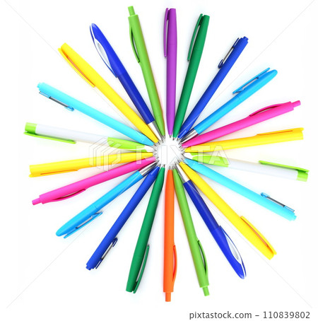 Multi colored ball pens on white background 110839802