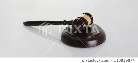 Judge hammer with stand on gray background 110839874