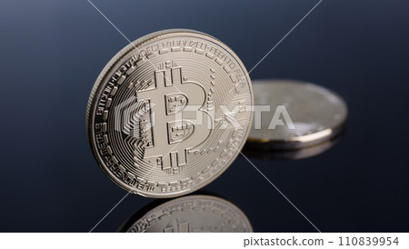 Coin of crypto currency bitcoin on a gray-blue Coin of crypto currency bitcoin on a gray-blue 110839954
