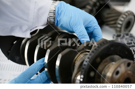 The mechanic of the service center for engine The mechanic of the service center for engine 110840057