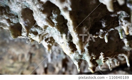 Stalactites inside a natural limestone cave in Kagoshima Prefecture 110840189