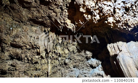 Stalactites inside a natural limestone cave in Kagoshima Prefecture 110840191