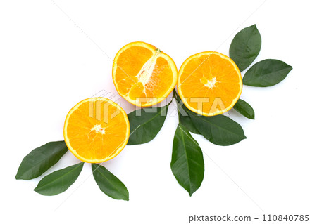 Orange fruit with green leaves on white background. 110840785