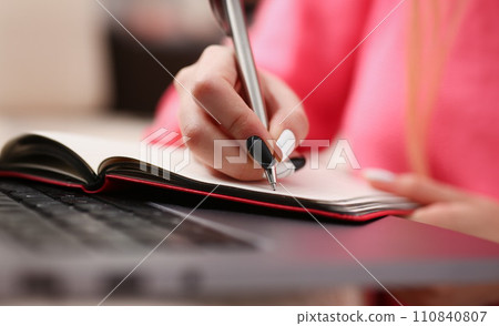 woman study hard write down information to notebook woman study hard write down information to notebook 110840807