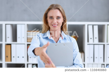 Businesswoman offer hand to shake as hello in office Businesswoman offer hand to shake as hello in office 110840860