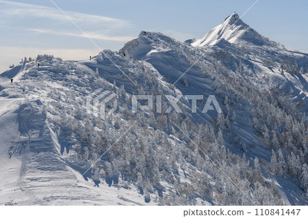 Mt. Kengamine in winter seen from the mountain trail heading from Mt. Kengamine to Mt. Buson Mt. Kengamine in winter seen from the mountain trail heading from Mt. Kengamine to Mt. Buson 110841447