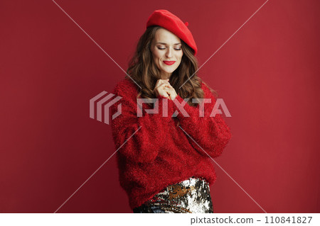 smiling trendy woman in red sweater and beret smiling trendy woman in red sweater and beret 110841827
