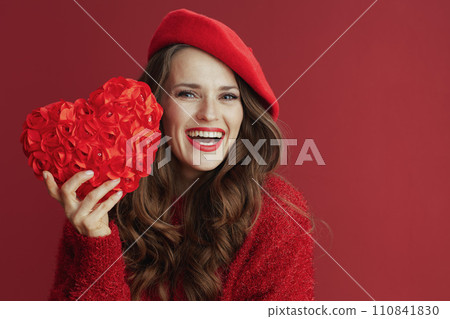 smiling elegant 40 years old woman in red sweater and beret smiling elegant 40 years old woman in red sweater and beret 110841830
