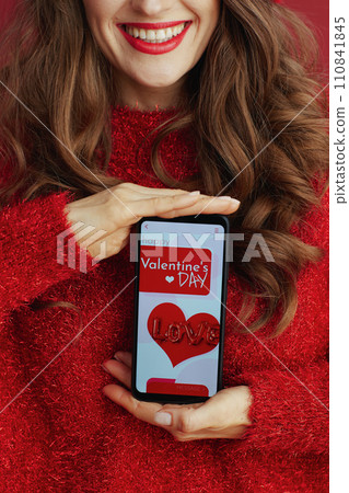 Closeup on female in red sweater and beret 110841845