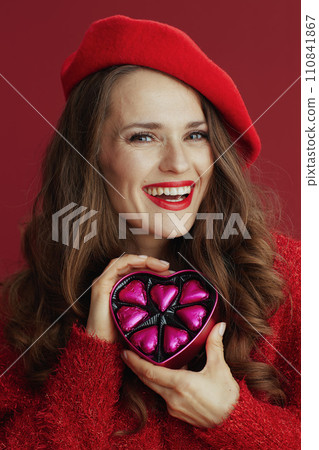happy modern female in red sweater and beret 110841867