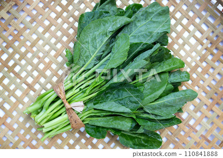 Collard greens on bamboo weave plate Collard greens on bamboo weave plate 110841888