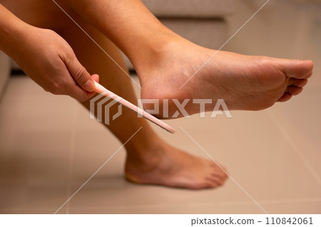 Foot with foot file, Cleansing the heel Foot with foot file, Cleansing the heel 110842061