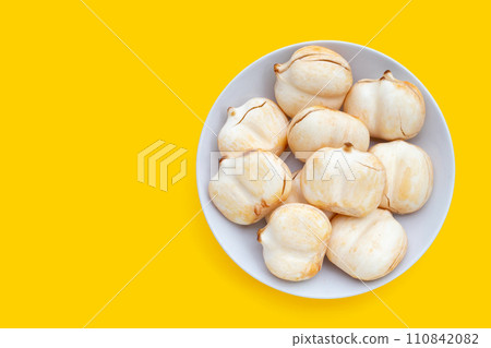 Toddy palm on yellow background. 110842082