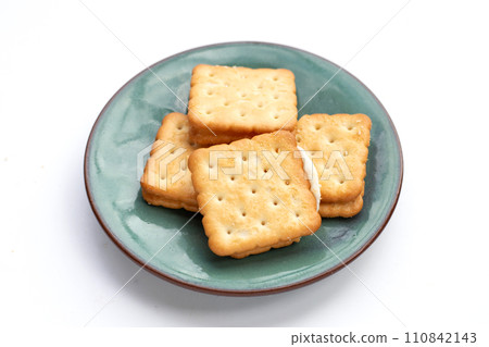 Biscuits in plate on white background. 110842143