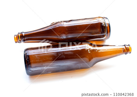 Empty brown bottles on white background. Empty brown bottles on white background. 110842368