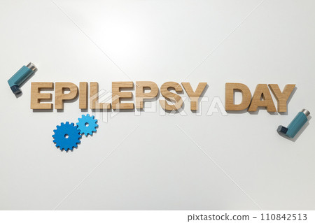 Epilepsy day written in wooden letters with inhalers 110842513