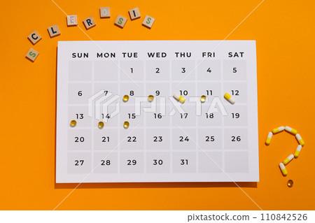 Calendar with pills and the inscription sclerosis 110842526