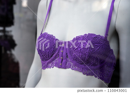 Closeup of purple bra on mannequin in a fashion store showroom Closeup of purple bra on mannequin in a fashion store showroom 110843001