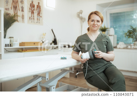 happy female massage therapist in massage cabinet 110843071