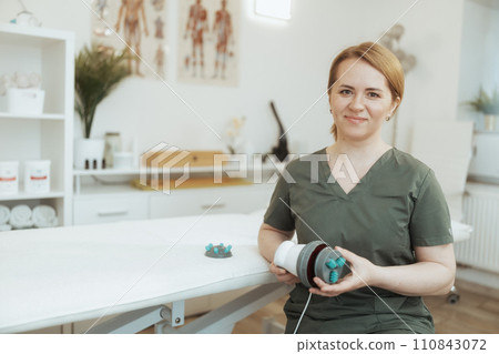 happy female medical massage therapist in massage cabinet happy female medical massage therapist in massage cabinet 110843072