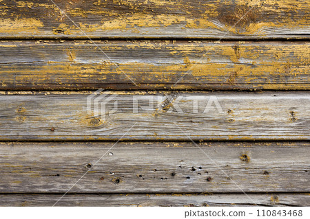 Old wooden painted and chipping paint. 110843468
