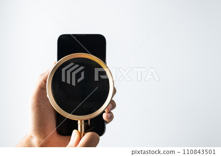 Mobile Phone Magnifier for Innovative Online Search online search and cyber security concept. 110843501