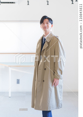 A businessman wearing a coat 110843811