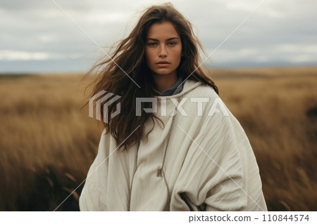 beautiful woman stands in the vast openness of golden field. Generative AI 110844574