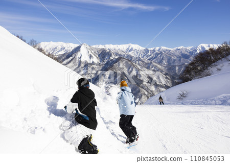 children enjoying snowboarding children enjoying snowboarding 110845053