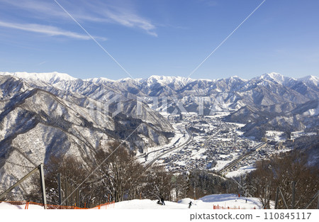 Yuzawa town and beautiful snowy mountains Yuzawa town and beautiful snowy mountains 110845117