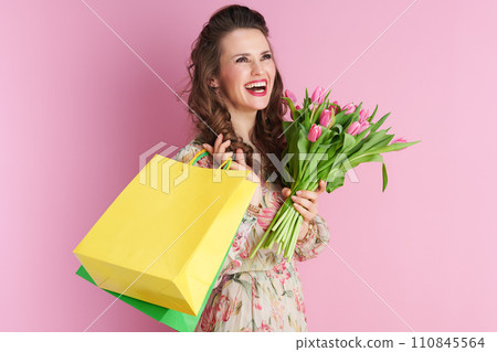 happy stylish woman with long wavy brunette hair on pink happy stylish woman with long wavy brunette hair on pink 110845564