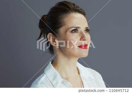 pensive business owner woman looking at copy space against gray 110845712