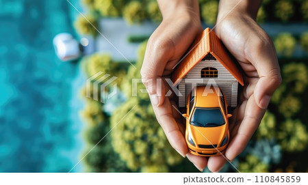 Hands holding car and house. 110845859