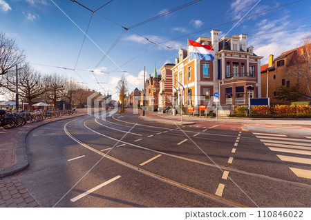 Amsterdam tram, flag and dutch houses Amsterdam tram, flag and dutch houses 110846022